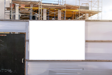 banner for advertisement on fence of construction site at city street mock-up