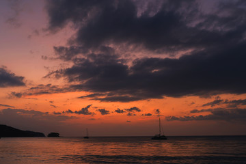 Fototapeta na wymiar Blue sky with cloud bright background at Phuket Thailand. Twilight time orange tone.