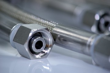 Stainless steel pressure hose with screw connection.