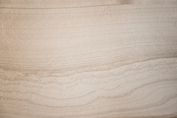 Obraz premium waves and lines on structured natural stone background texture