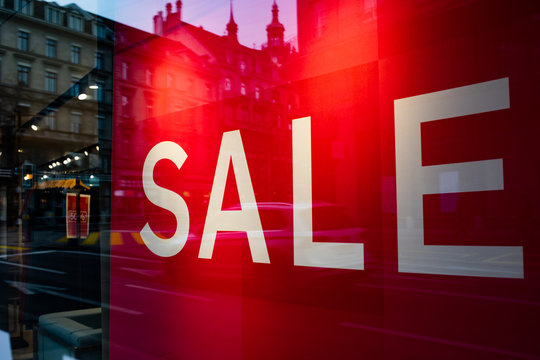red sale sign in a shop january sales