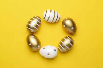 Happy Easter golden shine decorated eggs in basket isolated on yellow background. For greeting card, promotion, poster, flyer, web-banner, article