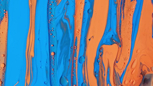 Colorful static footage. Blue and red paint dissolve in a solvent. Can be used as a background