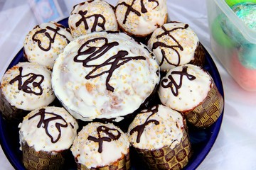 Orthodox Easter cakes, with white icing on a dark dish in the shape of a flower. concept of...