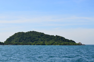 Beautiful green island against blue sky