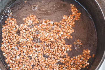 Rinse buckwheat in water before cooking