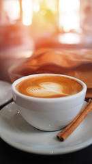 Hot coffee cups with beautiful latte art  on table in coffee shop, selective focus for background