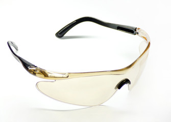 Safety glasses made of plastic isolated on a white background close-up.