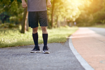 Fototapeta premium Asian Runner man running in city park morning outdoors