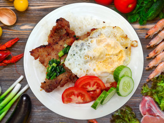 Com Tam - Closeup of vietnamese food: Delicious broken rice with egg pie and BBQ pork chop. fried...