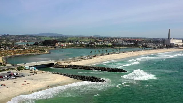 Aerial drone footage of Carlsbad state beach and the lagoon in San Diego, California. 