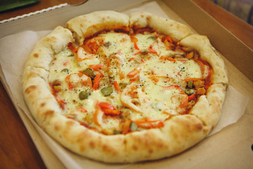 pizza with tomatoes, olives and cheese close up. fast food advertising, confectionery, cooking, overeating, diet, Italian food