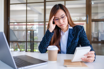 Businesswoman get stressed while having a problem at work in office