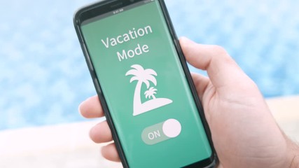 Turning the vacation mode ON on a mobile phone while being poolside