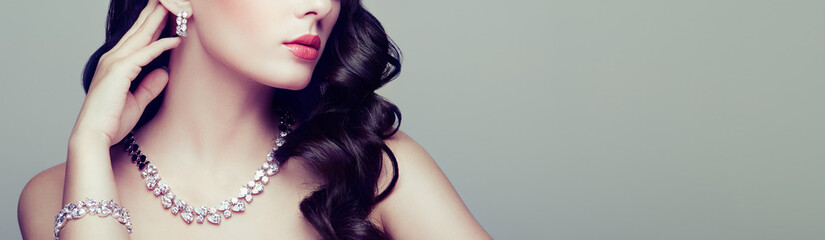 Brunette Girl with Long and shiny Curly Hair. Beautiful Model Woman with Curly Hairstyle. Care and...