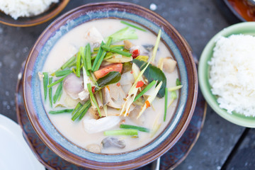 Coconut milk soup with seafood or Thai people call Tom Kha Talay.Thai ingredients and rice.Thai food menu that is popular in Thailand.