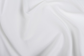 Obraz premium Biała tkanina tekstura tło. Tkanina miękka fala. Zagniecenia z satyny, jedwabiu i bawełny.