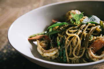 Pesto Spaghetti with shimp in high contrast italian food
