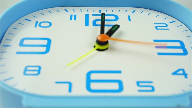 Alarm clock show time 12.30 am or pm. Time passing 30 minutes Clock walking. Time lapse moving fast on white background.