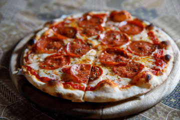 Pepperoni pizza on wood plate italian food