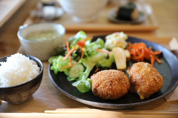 Beef Croquette with rice and salad japanese style Korokke on wooden