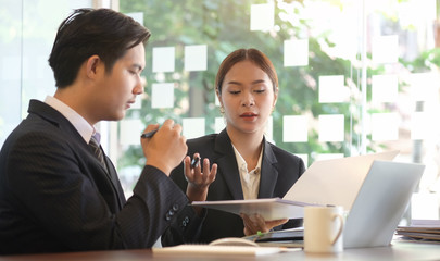 Business working in office with documents and laptop people Consulting and business planning.