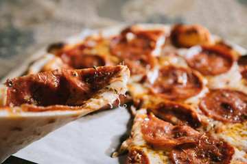 Pepperoni pizza on wood plate italian food
