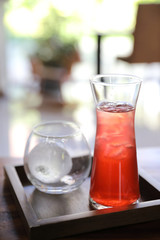 Strawberry iced tea on wood background