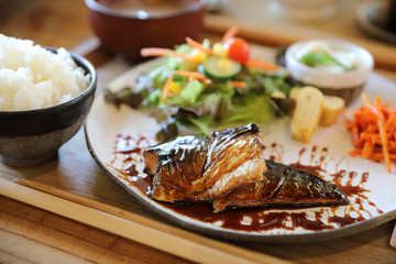 Saba fish teriyaki with rice soup and salad on wood background , Japanese food