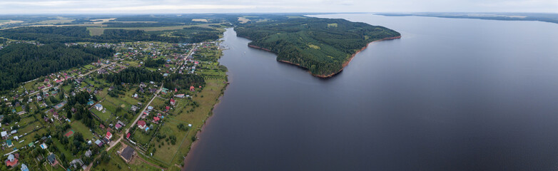 Aerial view of the Votkinsk Reservoir (on the river of Kama) and village Stepanovo on its coast. Perm Krai, Russia