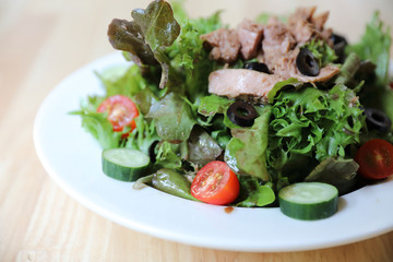 Tuna salad appetizer on wood background