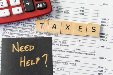 New Canadian personal tax forms and letter tiles showing refunds and taxes