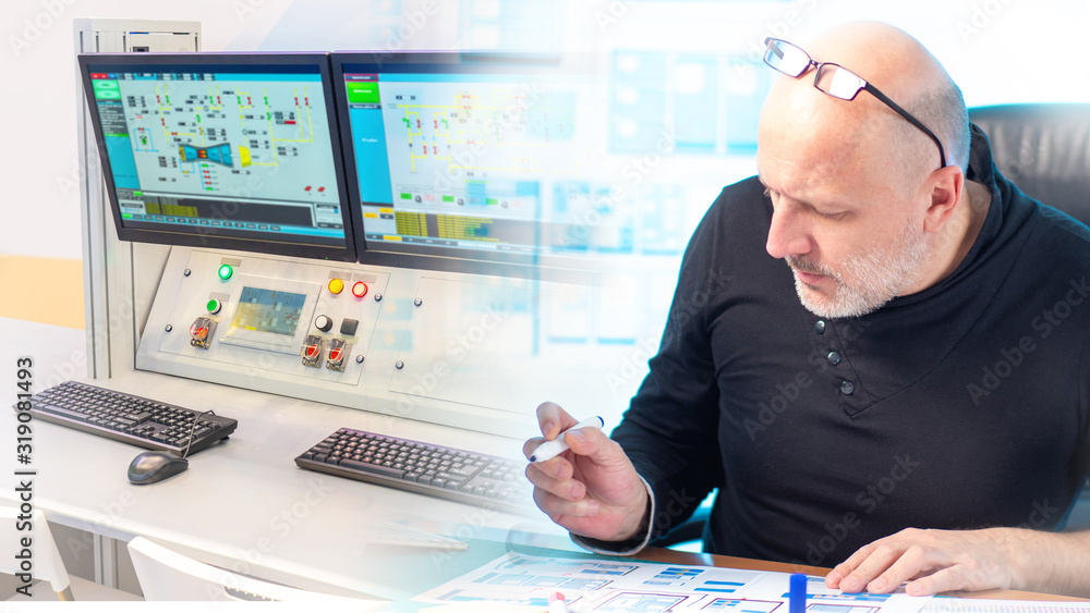 Aufkleber engineer at his desk on the background of the control panel. dispatcher at an industrial enterprise.