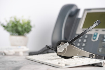 VOIP headset headphones telephone on office desk concept for communication, it support, call center...