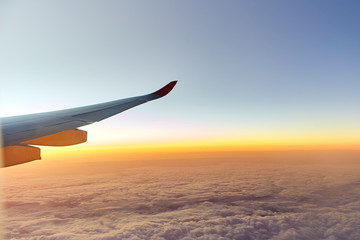 Wing of an aeroplane with sunset