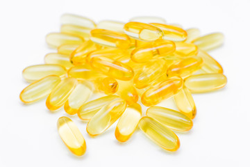 Close up of capsules Omega 3 on white background. Health care concept