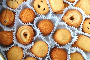 An overhead or flat lay view of Danish butter cookies in the traditional tin box. valentines day gift. with copy space