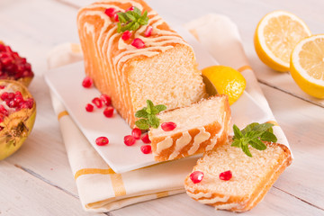 Lemon sponge cake with pomegranate.