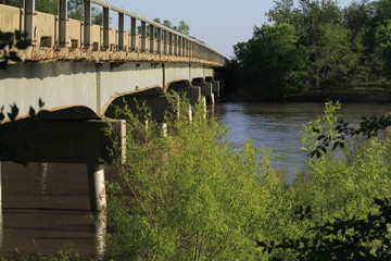 bridge over the Arkansas river west of Sterling Kansas USA out in the country.