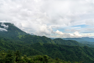 beautiful blue sky high peak mountains mist fog wildlife green forest at Khao Koh, Phu Tub Berk, Phetchabun, Thailand  guiding idea long weekend for backpacker camping campfire relaxing hiking