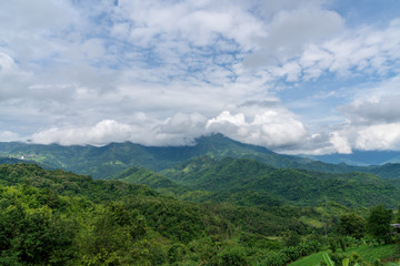 beautiful blue sky high peak mountains mist fog wildlife green forest at Khao Koh, Phu Tub Berk, Phetchabun, Thailand  guiding idea long weekend for backpacker camping campfire relaxing hiking