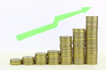 The chart is made up of coins symbolizing the growth of profits, salaries, social benefits. Green up arrow. Camera focus arrow.