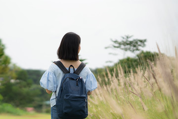 young cute Japanese Asian hipster girl travelling at beautiful sky  mountains scenery park hiking garden views at Kanchanaburi Thailand guiding idea for female backpacker woman women backpacking