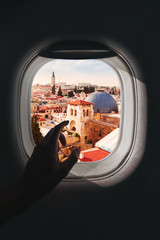 Airplane window with a aerial panorama of Jerusalem, Israel during a flight
