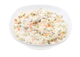 portion of russian Olivier salad in white bowl