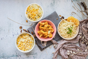 Vegan or vegetarian lunch or dinner food. Couscous and tomato paste cooked cauliflower