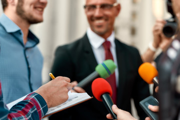 Ready to perform. Journalists conducting interview of politician. Journalism industry, live...