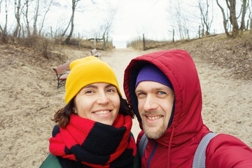 Smiling couple on the spring beach