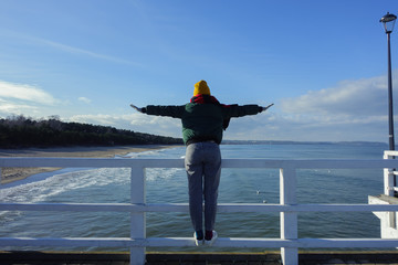 A girl enjoying sea wind