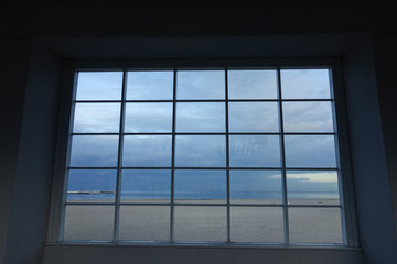 Sea scape with a blue sky through the window